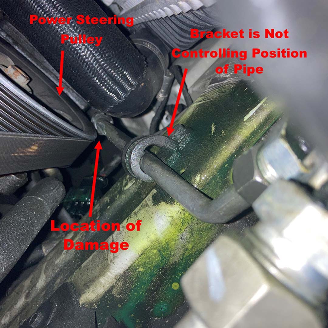 view looking up at damaged refrigerant pipe